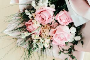 Light pink floral bouquet and delicate greens.