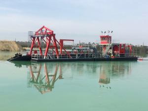 This is a deep digging electric powered mining dredge designed and built by Custom Dredge Works.  This dredge has a long-ladder with an underwater pump mounted on the dredge ladder.  This dredge is meeting or exceeding production expectations.