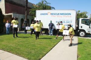 Volunteers Greet Union Rescue Mission Truck To Load Donations