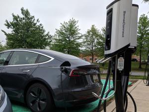 SemaConnect Series 5 smart EV charging stations charging a Tesla