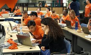 Students collaborating with other code academy students