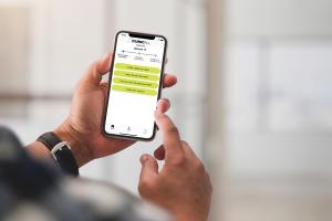 ClinicAll Communicator App displayed on a smartphone