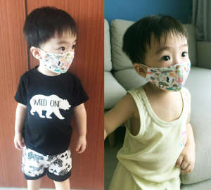 A little boy is wearing a cute designed Ultifresh™ Reusable Mask