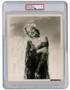 Signed publicity still of Marilyn Monroe from the 20th Century Fox movie How to Marry a Millionaire, PSA/DNA slabbed and graded NM-7 (est. $12,000-$14,000).