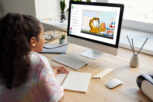 Girl playing and learning with Garfield at Home