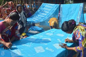 Women of Katakhali Village, Bangladesh decorating Climate Change saris.