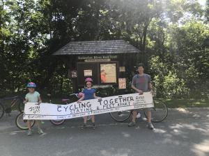 Trek Across Maine photo of cyclists social distancing