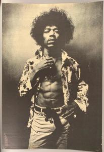 Vintage black-and-white poster of Jimi Hendrix, stylishly dressed in a cool flowered shirt, pendant necklace and chain and tied belt, 30 inches by 20 inches, unframed (est. $75-$150).
