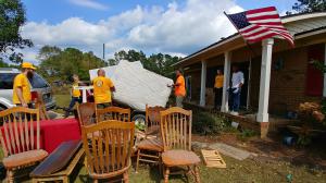 Scientology volunteers helping families salvage belongings