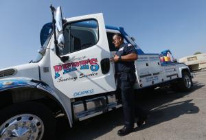 Pepes Towing truck and owner Manny Acosta