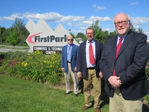 From left to right: Stephen Monsulick, Jr., president of FirstPark, Erik Urbanek, managing director of SVN | The Urbanek Group Advisors and Jim Dinkle, executive director of FirstPark take a photo at the entrance to the business park in Oakland. 