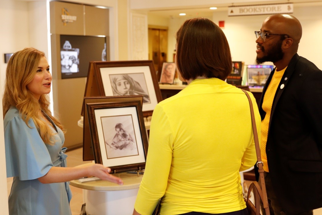 Erica Rodgers shows artwork at the 2019 Peace Day Pop-Up Exhibit at the Church of Scientology, Washington, DC.