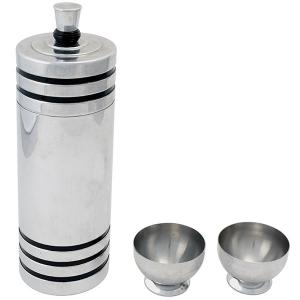 American “Gaiety” cocktail shaker and pair of cups, chrome-plated metal with Bakelite bands. Designed by Howard Reichenbach for Chase Brass & Copper Co., Waterbury, Conn.; marketed as the “Holiday Cocktail Set,” c.1934, sold with original boxes, shaker 11