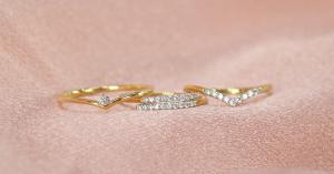 Gold and lab grown diamond fine jewelry rings on pink silk fabric