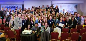 A large group of people who are professionals in the medical field, who have all gathered to see over a dozen highly qualified speakers from around the world.
