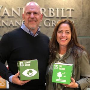 Two Founders holding UN SDG Boxes