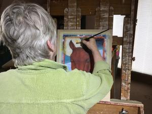 Lori Faye Bock creating her Christmas holiday painting (Silent Light) in her Abiquiú farm studio.