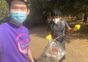 Justin Sha and event attendees are pictured cleaning up the Alameda Creek Regional Trail.