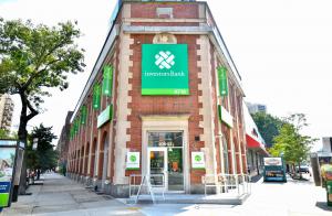 Color photo of exterior of Investors Bank's Forest Hiils branch on Queens Boulevard