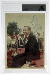 Signed photograph of Neil Armstrong, 5 inches by 7 inches, authenticated and encapsulated by Beckett Authentication Services (est. $400-$500).