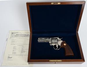 Cased, factory engraved Colt 4in nickel Python .357 Magnum in like-new, unfired condition in walnut Colt display case. Factory letter states gun was shipped to buyer in 1979. Estimate $7,000-$9,000