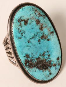 Indian cuff silver bracelet with a prominent Kingman turquoise stone, measuring 4 inches by 2 ¼ inches. The sterling cuff was 6 inches. The bracelet brought $2,250.