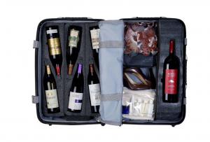 An Open Wine Suitcase with Clothes and a Magnum Insert