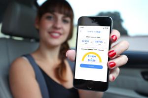 blurred photo of a woman holding her phone showing estimated cashback on screen from Cashifyd app