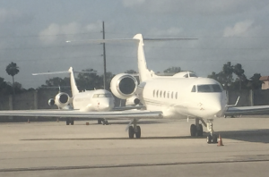 Private jets on the tarmac at Miami International Airport
