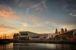 View of Liverpool docks across the water at sunset