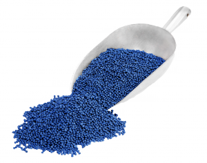 Picture of shovel which holds blue plastic-like pellets of UBQ material
