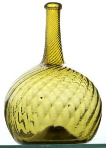 Pattern globular bottle made by Zanesville Glass Works in Ohio circa 1815-1835, medium yellow olive in color, with a 24-rib pattern swirled to the right, 8 inches tall ($7,500).