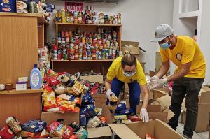 Scientologists sort donations for distribution to underserved residents.