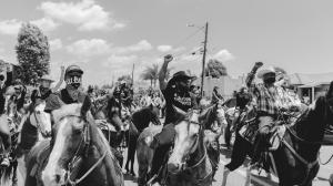 A photo of the Compton Cowboys riding in protest.