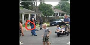 Mr Jackson in front of his home protesting ready to challenge those who disrespected the kids in the neighborhood  to a fair fight while a man stands next to him ready to shoot him who is a part of the White Lives Matter / Blue Lives Matter March in Fredericksburg, VA