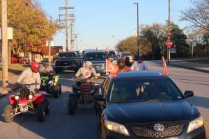 Motorbikes and 4-wheelers, cars and SUVs ride through the streets of Kansas City with their message of peace.