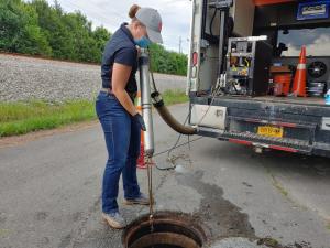 Mackenzie App, VP Product Management, Gravity Pipelines,, Electro Scan Inc. inserts ES-620 probe into sewer  main.