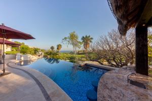 Complete with two show-stopping pools and a water slide.