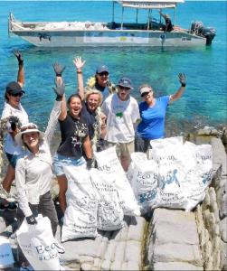 Beach Clean Up in the Whitsundays with eco Barge Clean Seas