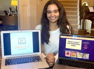 One of the Rath sisters showing the online platform Global Guru.