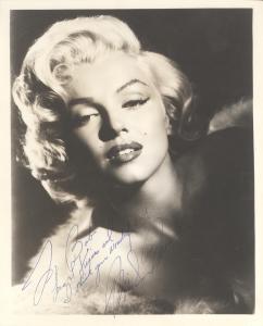 Signed and inscribed portrait photograph of Marilyn Monroe, inscribed to “Bob” (likely Robert Mitchum, Monroe’s co-star in the 1953 film River of No Return) (est. $12,000-$14,000).