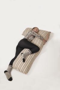 Woman hugging Essentia Body Pillow