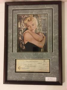 Typed check from 1959 signed by Marilyn Monroe, boasting a strong signature, matted and framed along with a photo of the late actress and with a certificate of authenticity ($3,120).