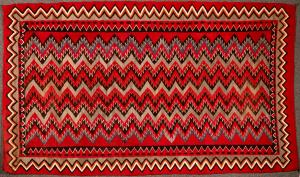 Stunning example of a Navajo Red Mesa Native American rug, near perfect condition, 5 feet by 8 feet 5 inches, with dramatic, exotic colors inspired by Hispanic weavings (est. $5,000-$8,000).