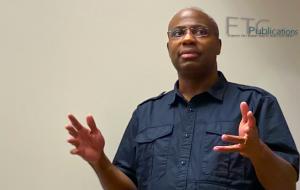 Photo of Warith Niallah in black shirt speaking.