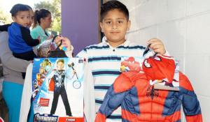 One of the many children that 10/31 Consortium has helped with their annual Halloween costume drives.