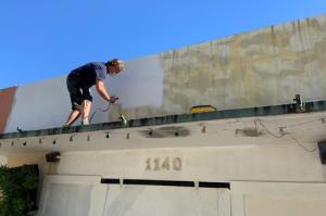 Jeff painting the bldg.