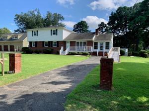 “514 E. Gwynnfield Road, Tappahannock, VA, is a well built one owner 5 bedroom 2 bath brick/vinyl sided home with a walk-out basement on a .34± acre lot one block off the Rappahannock River in Essex County, VA.  An adjacent .36± acre lot will convey with the home.
