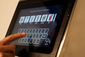 Up close photo of Easybar touchscreen showing variety of beverage options a bartender can choose from demonstrating how the system is fully programmable to customize recipes and procedures to suit each bar’s needs, interfacing directly with a bar’s existi