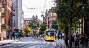 A tram going past Manchester's exchange square
